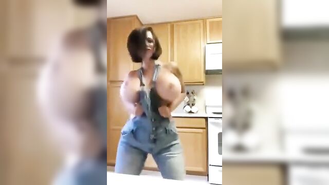 A happy brittany elizabeth dances with her captivating ass in thong