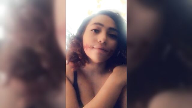 Curly-haired amateur girl miso plays with her soft boobs