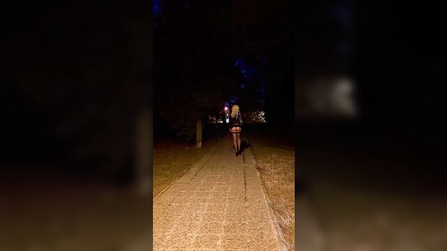 A girl is working as a prostitute on the street wearing sexy clothes