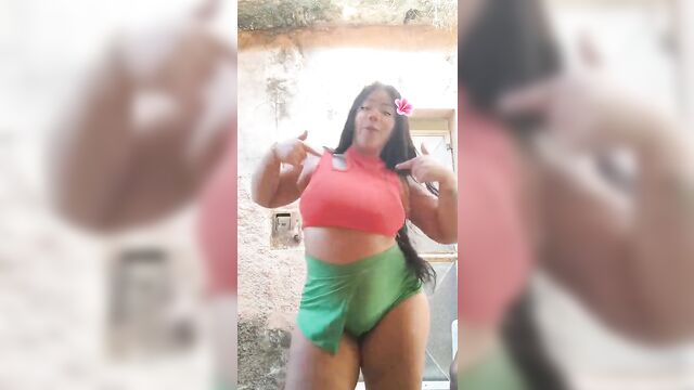 A black woman dances sensually with her big ass exposed