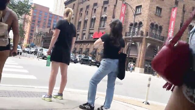 A sexy girl is walking around the gym in shorts and showing her ass