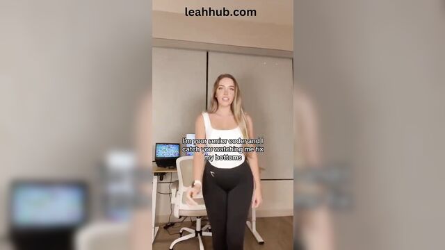 A blonde woman is fucking with the camera with her ass