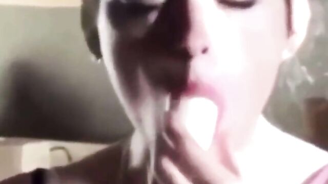 A young girl imitates a famous tiktoker and performs a blowjob