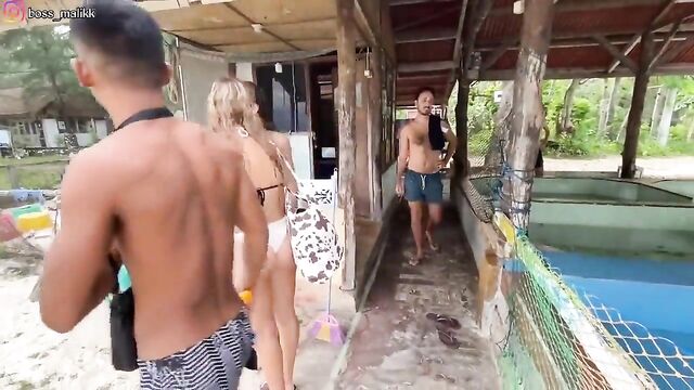 A sexy girl in thongs is having fun on the beach