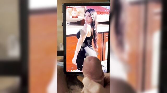 A man masturbates while watching a dirty latina whore on tv