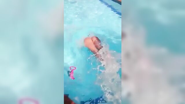 A white woman got naked in the pool and caressed herself