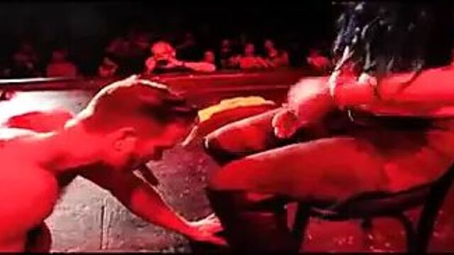 Paige getting a lap dance from a male stripper